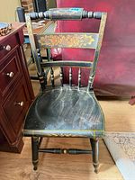 Full view of chair front showing design and wear