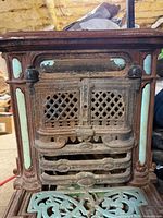 Front view showing lattice door, enamel trim, rust