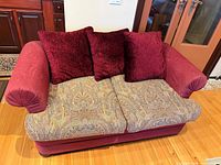 Front view of loveseat showing upholstery and cushions