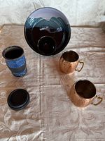 All items in lot: chip and dip bowl, travel mug with lid, two copper mugs