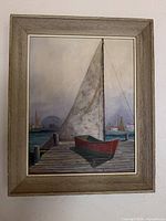 Full view of framed sailboat oil painting