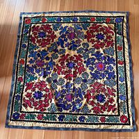 Multicolour embroidered textile with gold background shown full