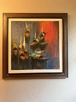 Frontal view of framed Uto Segovia oil painting