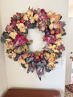 Full view of autumn wreath hanging on wall