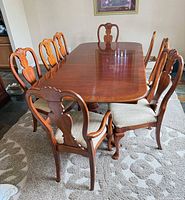 Top view of extendable dining table with all six chairs around it