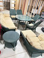 Entire set showing sofa, dining table, four chairs, side table, lounge chair and ottoman