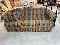 Full view of Broyhill sofa showing overall design, pattern, pillow and condition