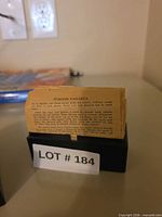 Italian Canasta rule sheet standing in open card case base