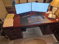 Front view of desk with monitors and accessories removed, showing desktop surface