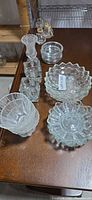 Group view of all clear glass pieces on table