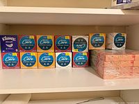 Shelf view showing Kleenex box, multiple Kroger Easy Care boxes, and shrink-wrapped floral tissue pack