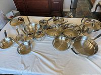 All cookware pieces laid out on table