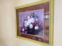 Front view of framed floral print on wall
