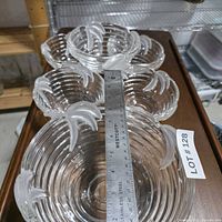 Top view of large bowl and four small bowls with ruler for scale