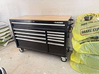 Front view of Husky rolling tool chest showing drawers, casters, side handle