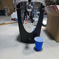 Front view of ICY COLD countertop kegerator with chrome tap and black housing