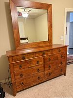 Front view of dresser with attached mirror