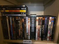 Full shelf view showing entire assortment of DVDs and tin box set