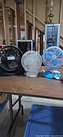 All three fans grouped on table