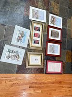 All eight prints laid out on floor to show variety and condition