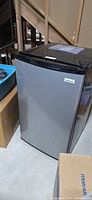 Front view of stainless Magic Chef mini fridge