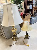 Both lamps side by side showing relative sizes, brass finishes, and shades