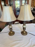 Both lamps with shades displayed on table