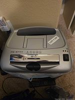 Top view showing model PS-67Cs, feed slot, control switch, silver finish