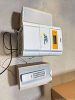 Main stereo unit with speakers and wiring visible