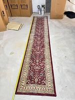 Full view of entire runner laid out with tape for scale