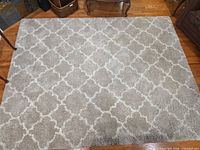 Full view of the beige and ivory trellis shag rug