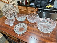 All six glass pieces displayed on tabletop