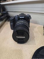 Front view Sony α100 with Tamron lens attached