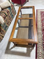 Top view showing three-panel glass surface and wood frame