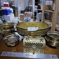 Group shot showing bowl, two pots, ashtray, trinket chest with ruler for scale