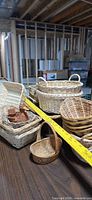 overview of assorted wicker baskets on table, showing variety of shapes and sizes