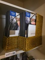 Two wicker magazine holders on shelf