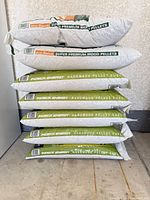 Stacked view of all seven pellet bags showing two eco-flame and five Indeck Energy