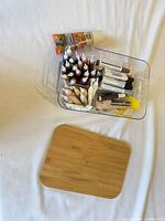 Overall lot showing organizer, lid and contents