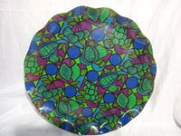 Front view showing colourful embedded fabric and scalloped edge