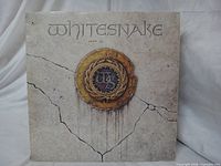 Front cover with Whitesnake crest artwork