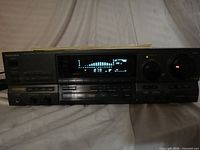 Front view of Technics SA-GX505 receiver, powered on