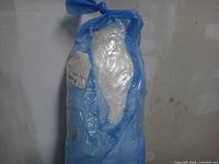 Top portion of roll wrapped in blue film