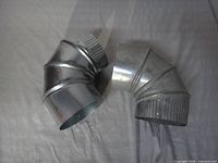 Both galvanized elbows side by side