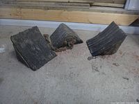 Three wheel chocks on concrete floor