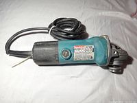 Full view of Makita 9523NB angle grinder with cord