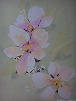 Close view of the painted apple blossoms showing color and medium