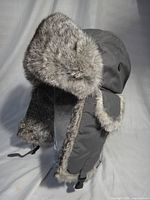 front view showing fur-trimmed ear flaps and chin straps