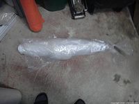 Entire roll sealed in plastic wrap on floor