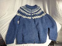 Sweater laid flat zipped showing full front view